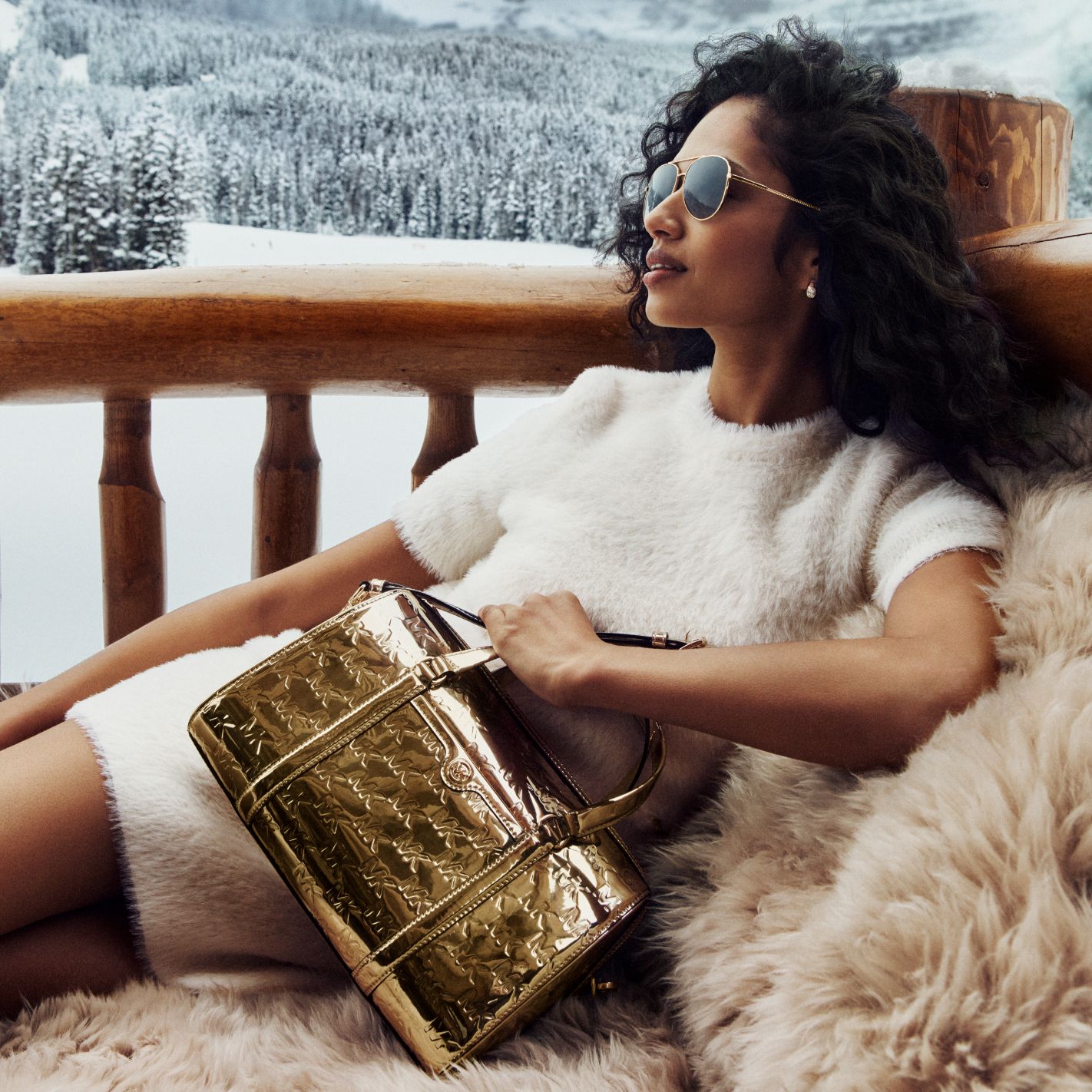 model with gold metallic bag