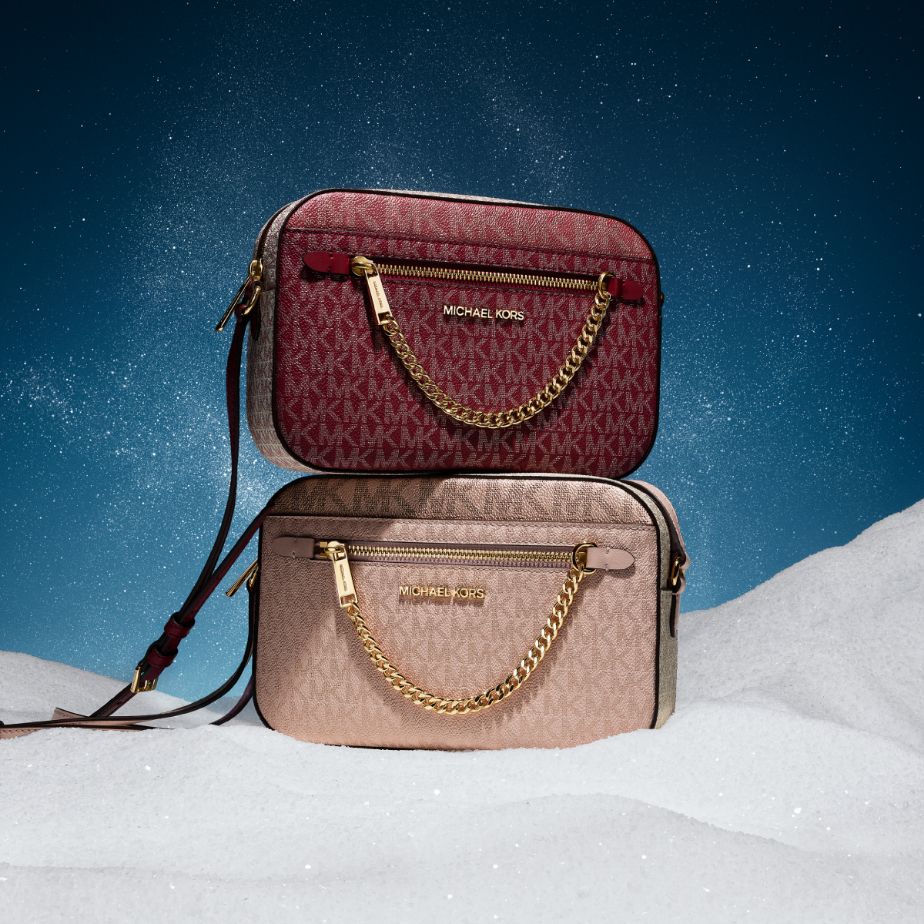 red and pink logo crossbody bags