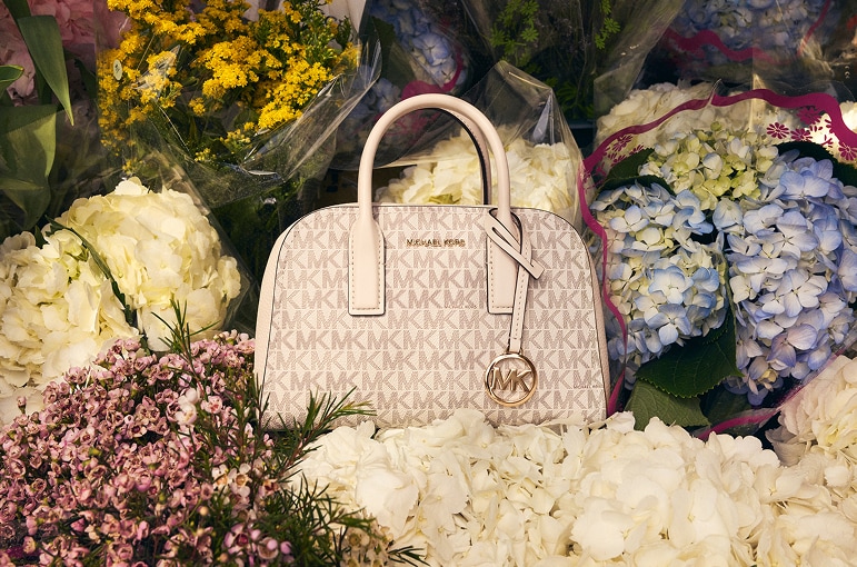 cream leather ashton handbag on flower bouquets