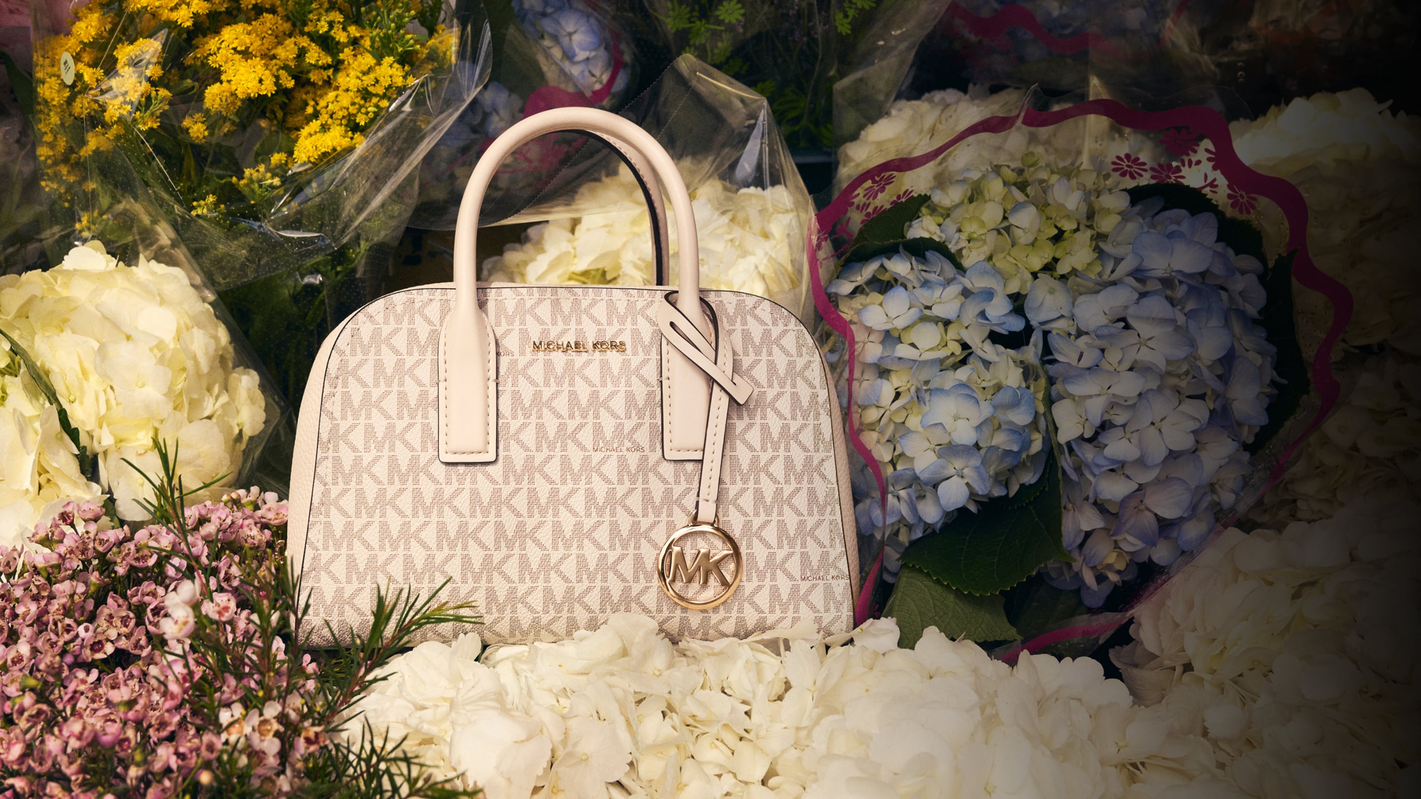 cream leather ashton handbag on flower bouquets