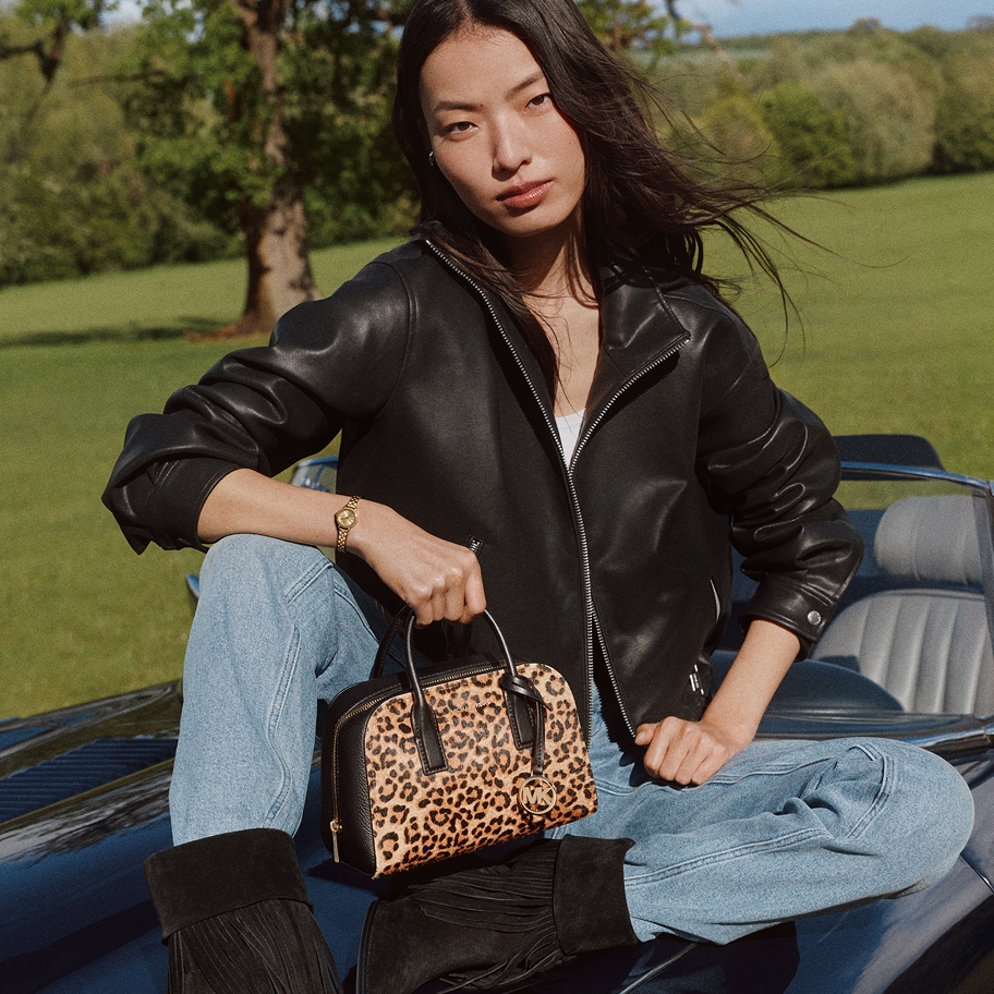 model holding ashton bag