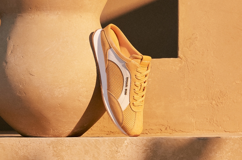 yellow mesh and suede sneaker with white stripe