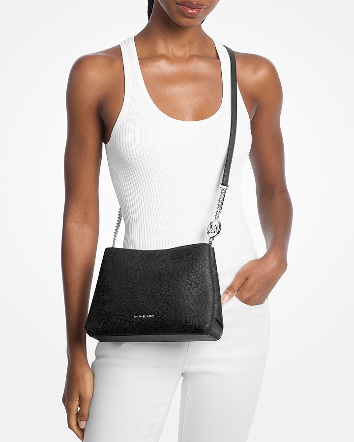 model with black christina crossbody bag