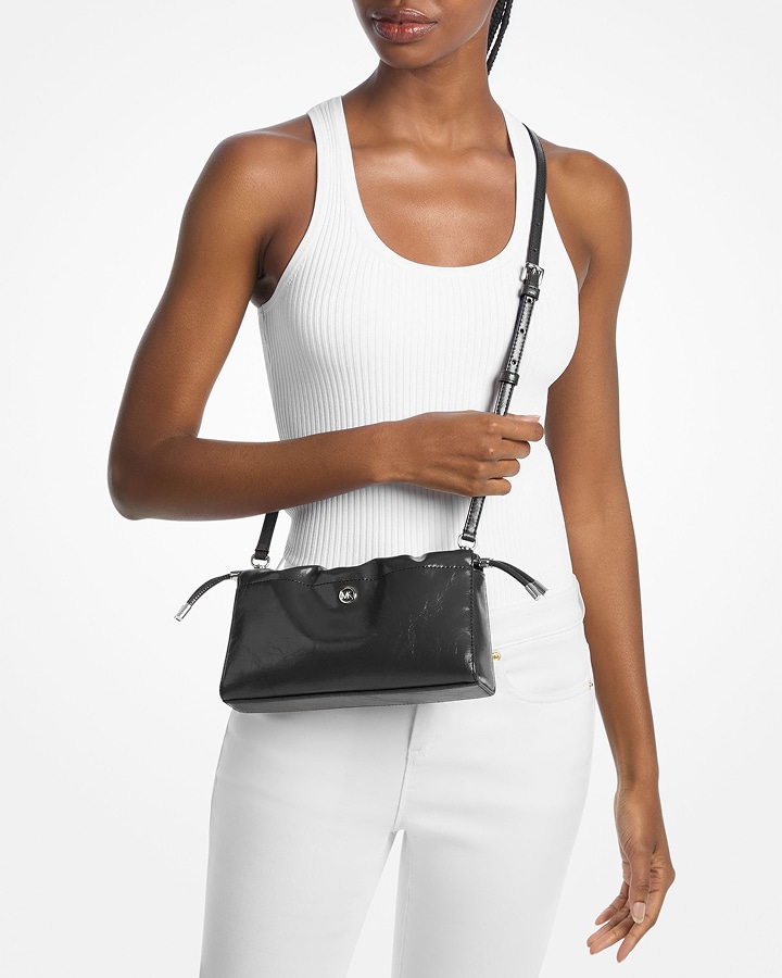 model with black matilda crossbody bag