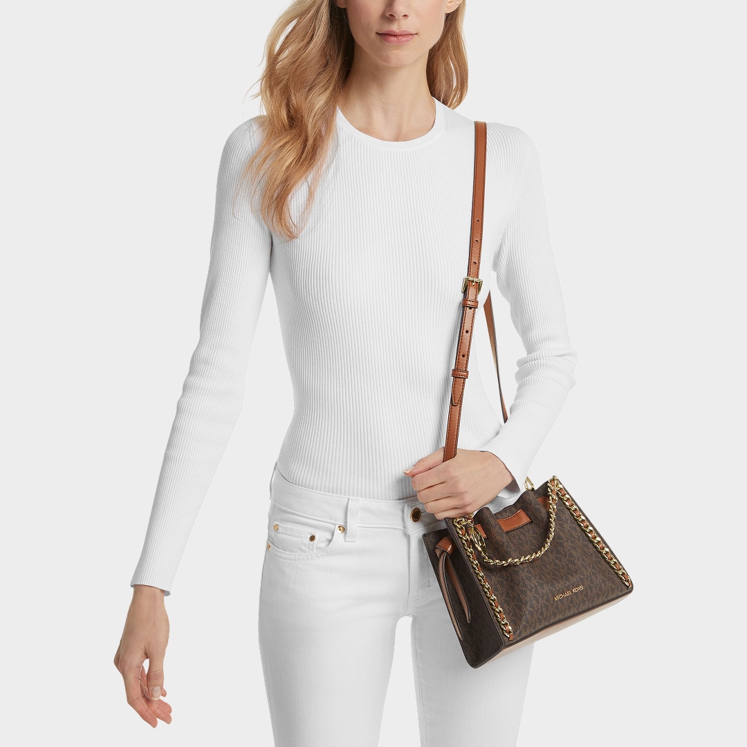 model with brown mina crossbody bag