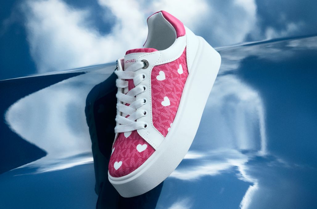 pink sneaker with white heart pattern