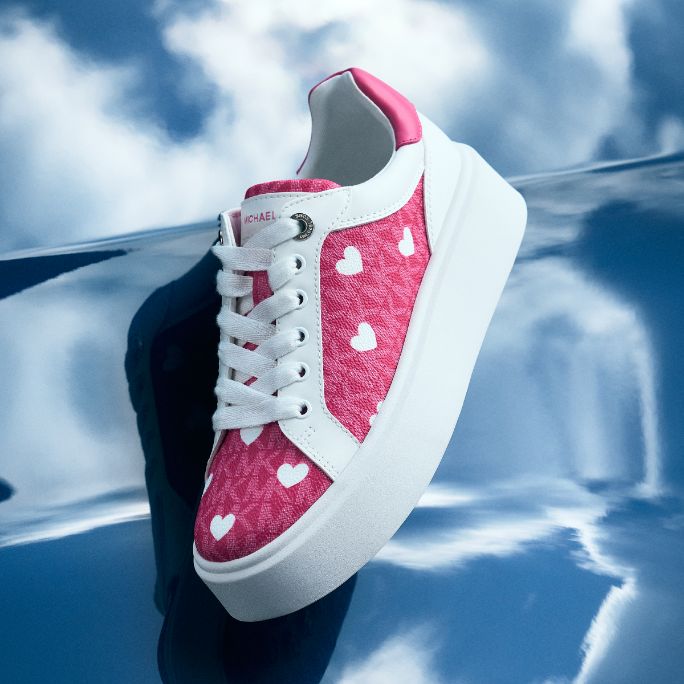 pink sneaker with white heart pattern