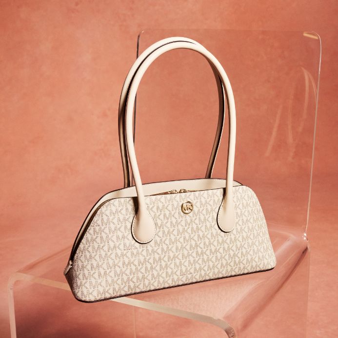 cream logo shoulder bag on peach background