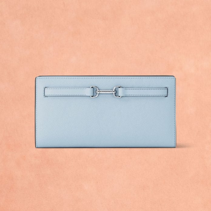 blue leather logo wallet on peach background