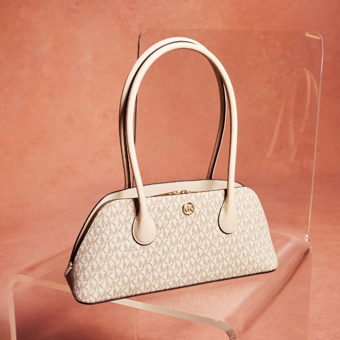 cream logo shoulder bag on peach background