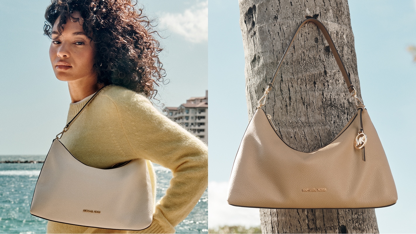 model in pale green wool sweater with brown leather sammy handbag