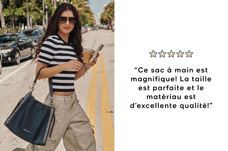 mannequin portant une chemise &agrave; rayures noires et blanches avec un sac &agrave; main mina noir