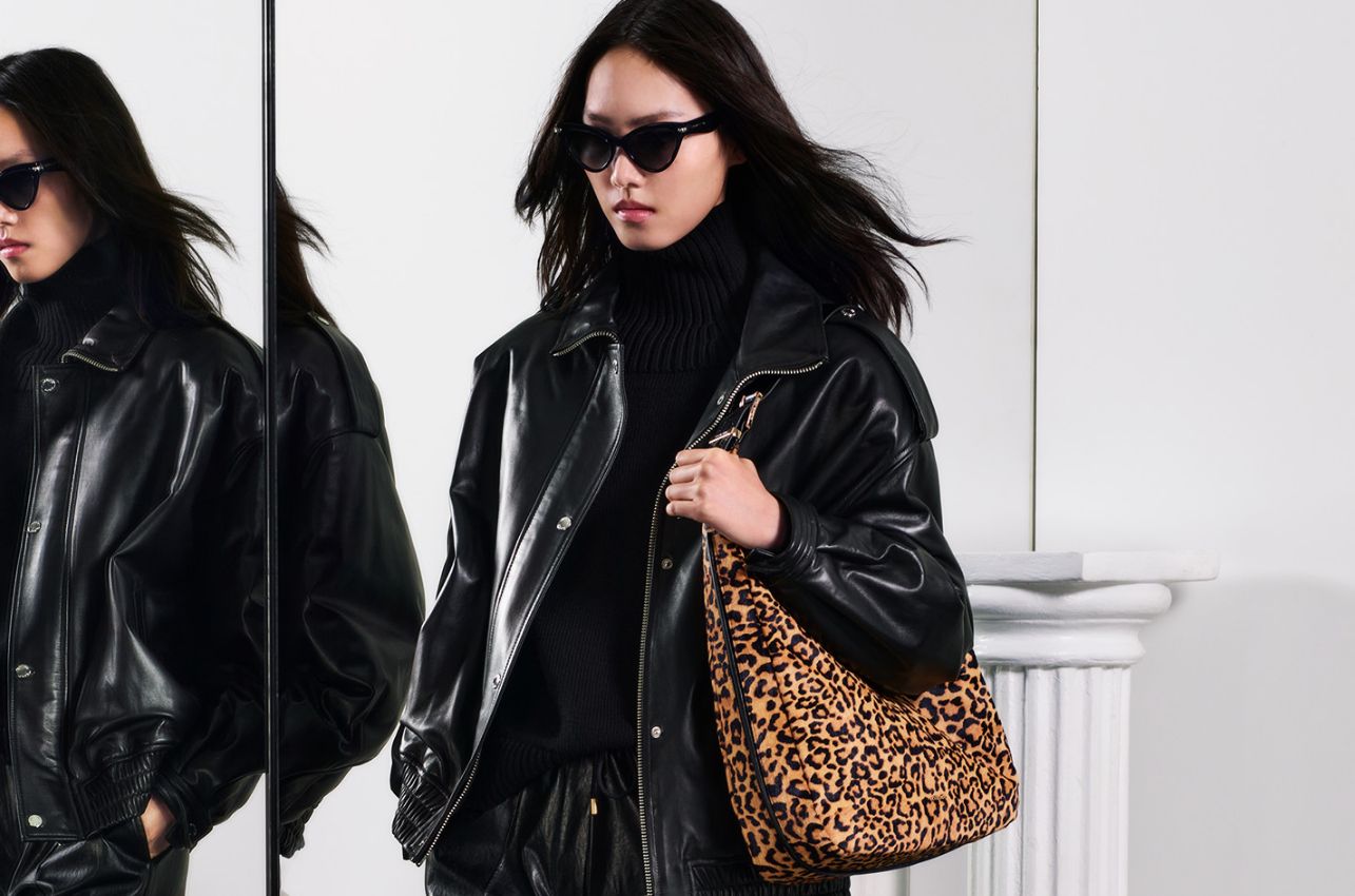 model with leopard print shoulder bag