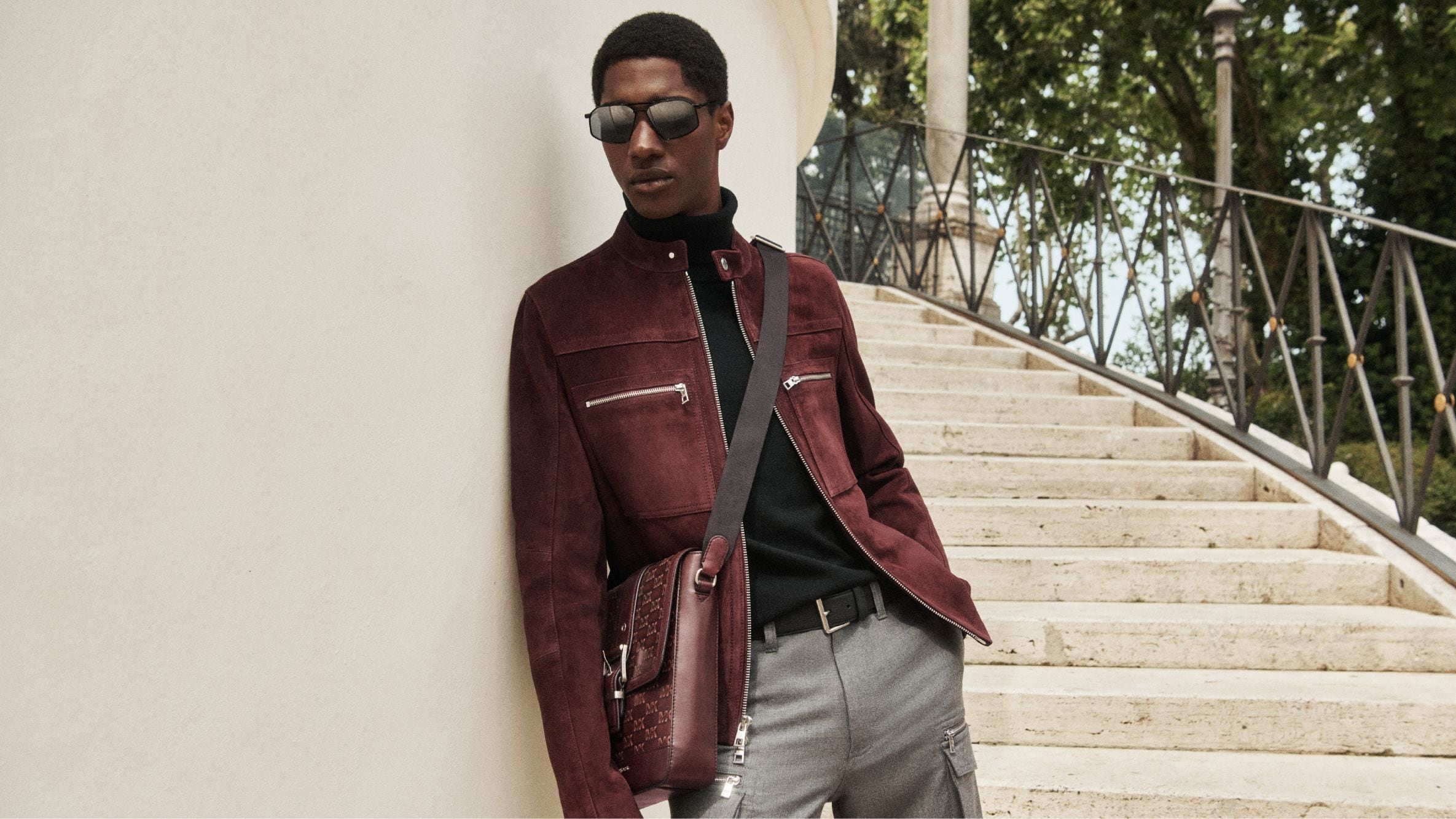 men's suede jacket and crossbody bag