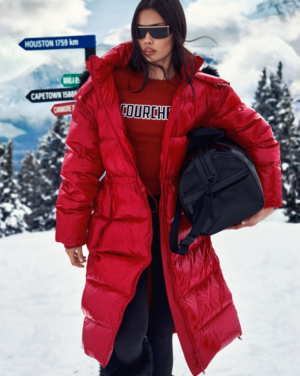 red puffer jacket and a duffle bag