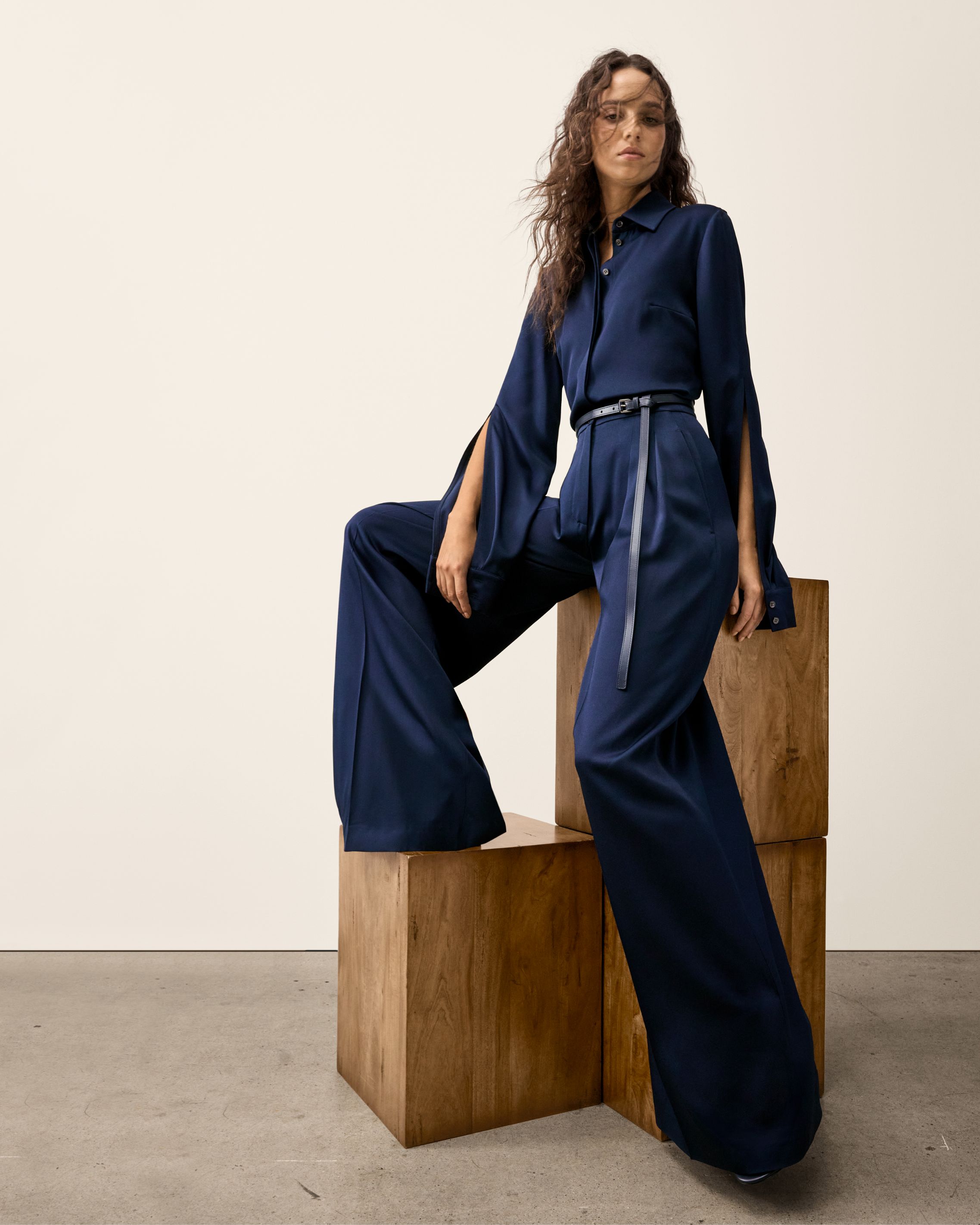 model in navy top and pants