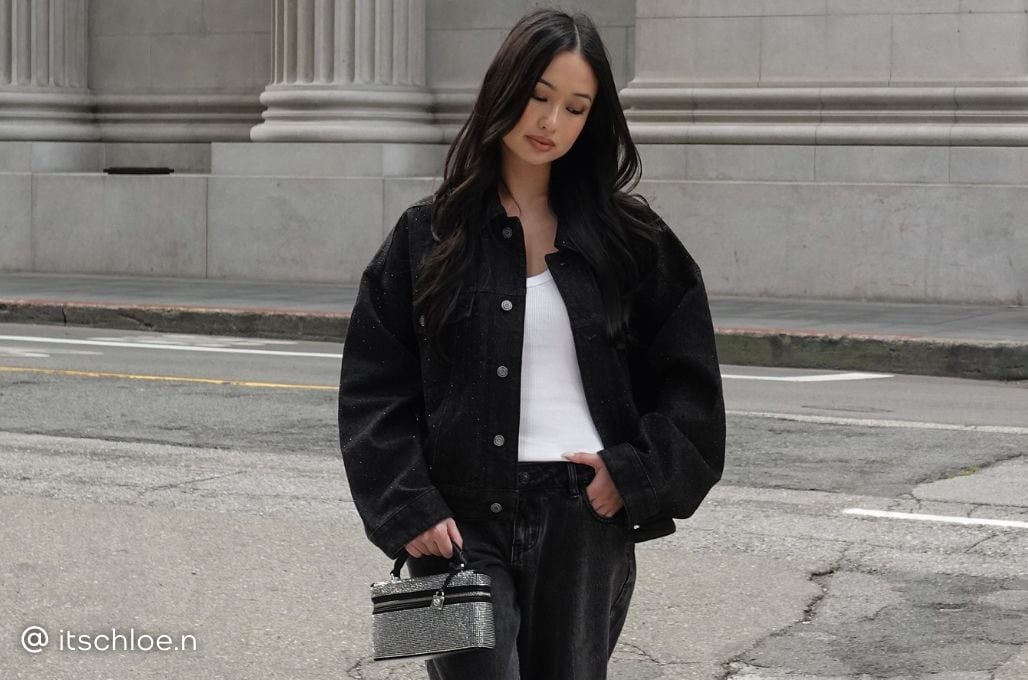 influencer wearing michael kors denim jacket and mini bag