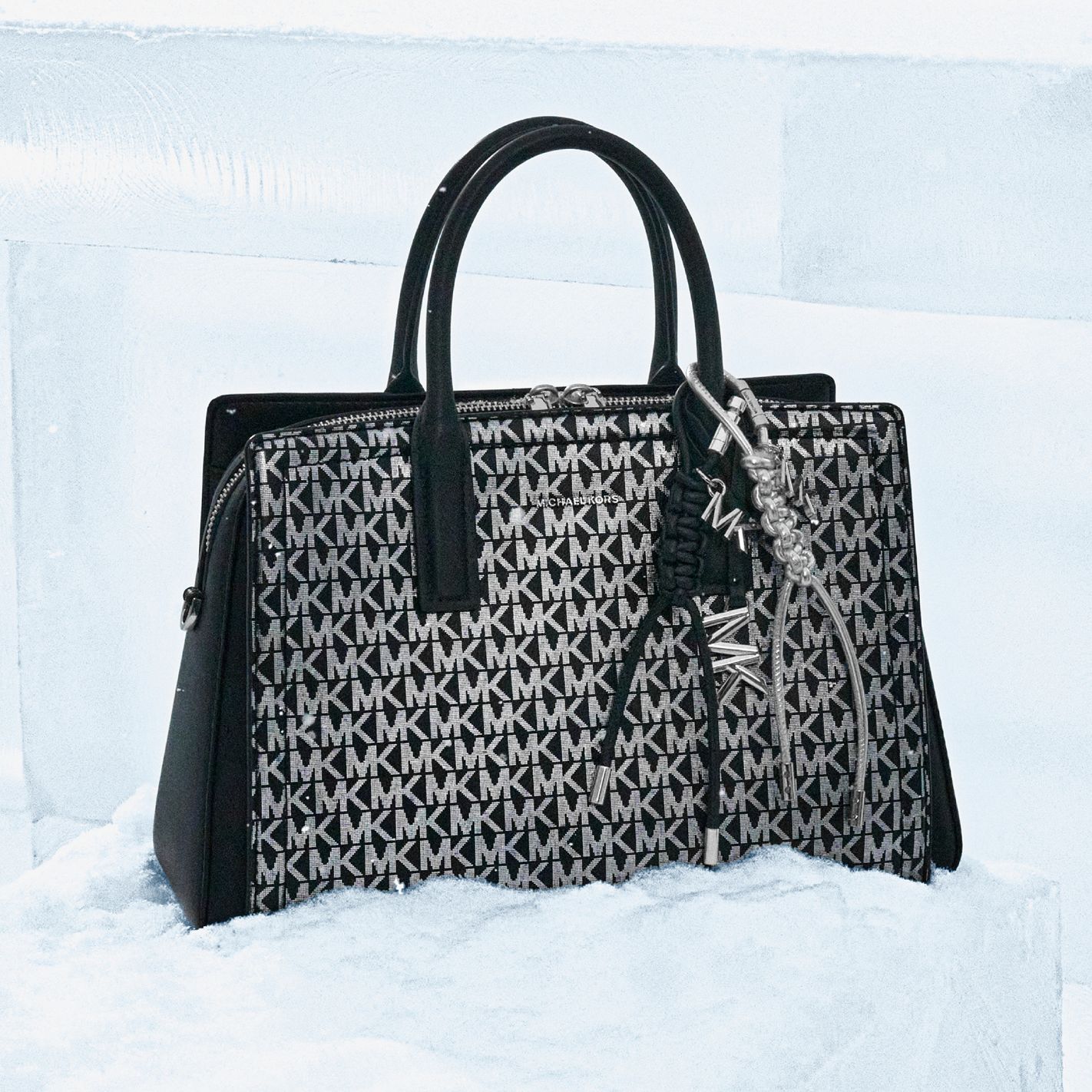 black and silver signature logo satchel