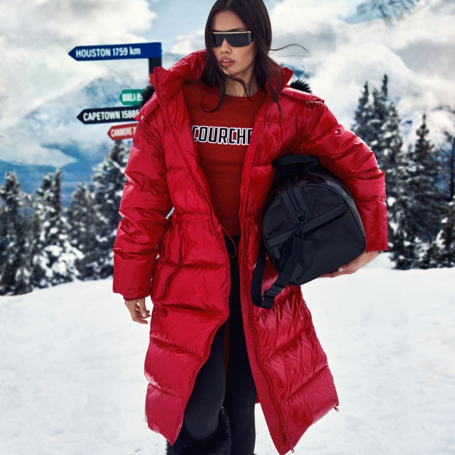 red puffer coat with duffle bag