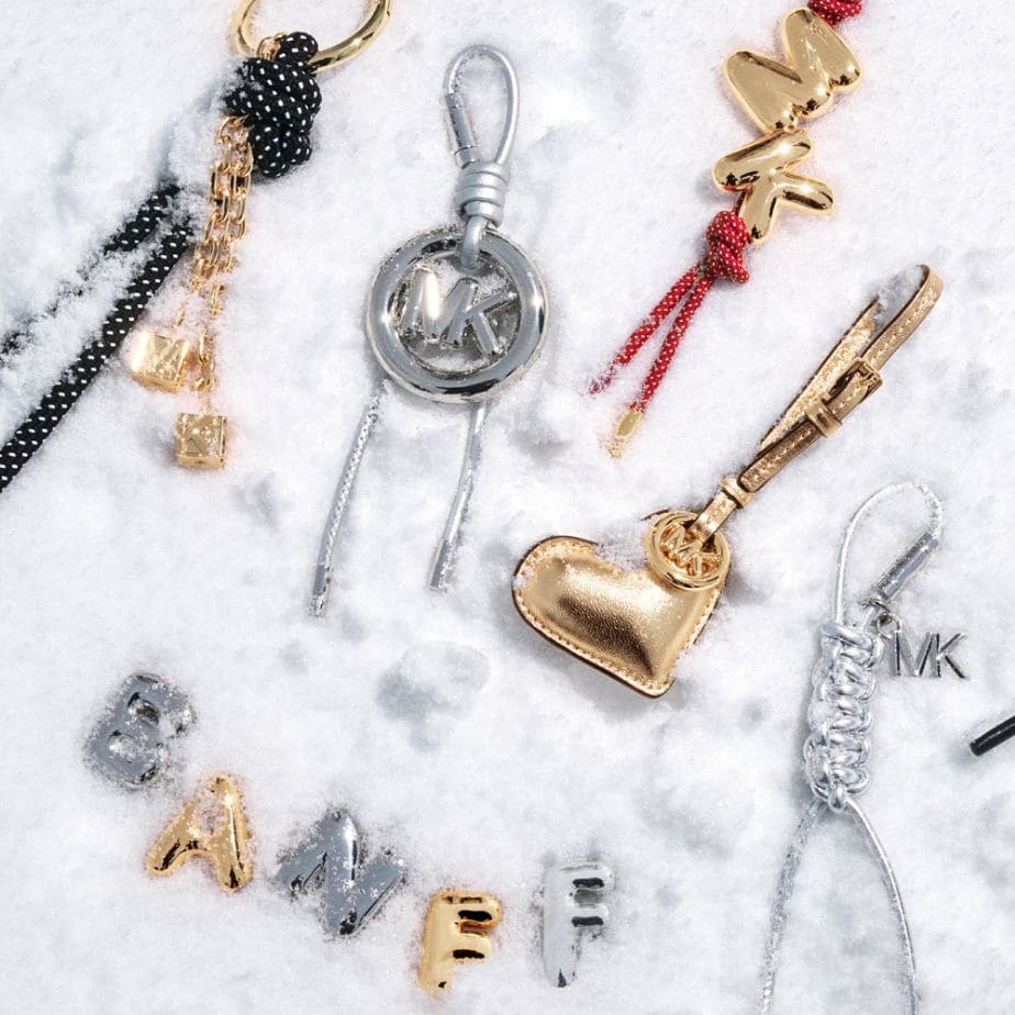 gold and silver bag charms in snow