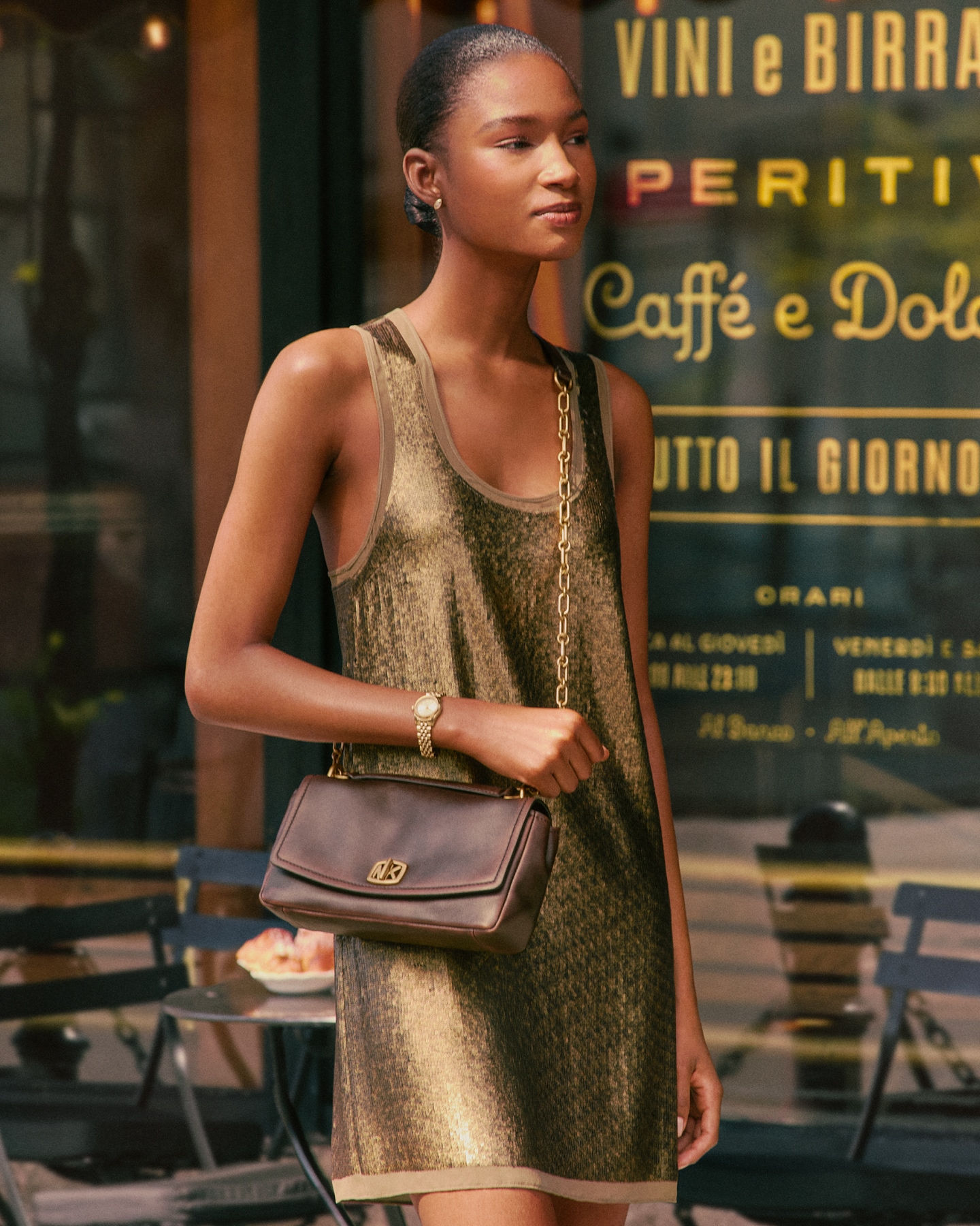 model with brown bryant handbag