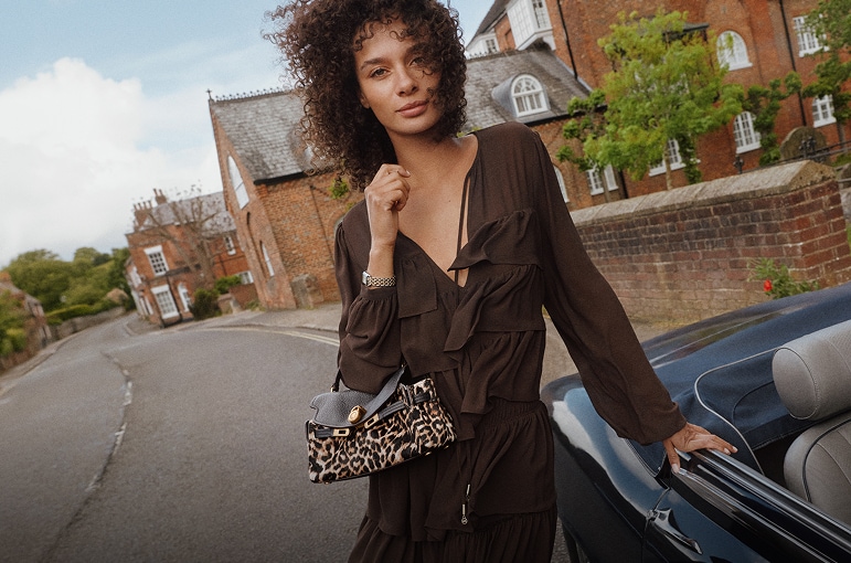 model with leopard print handbag