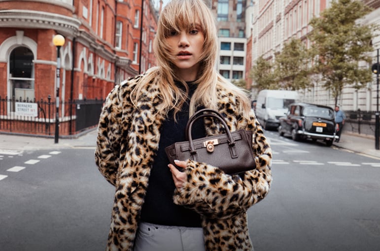 suki with leopard print coat and mini hamilton bag