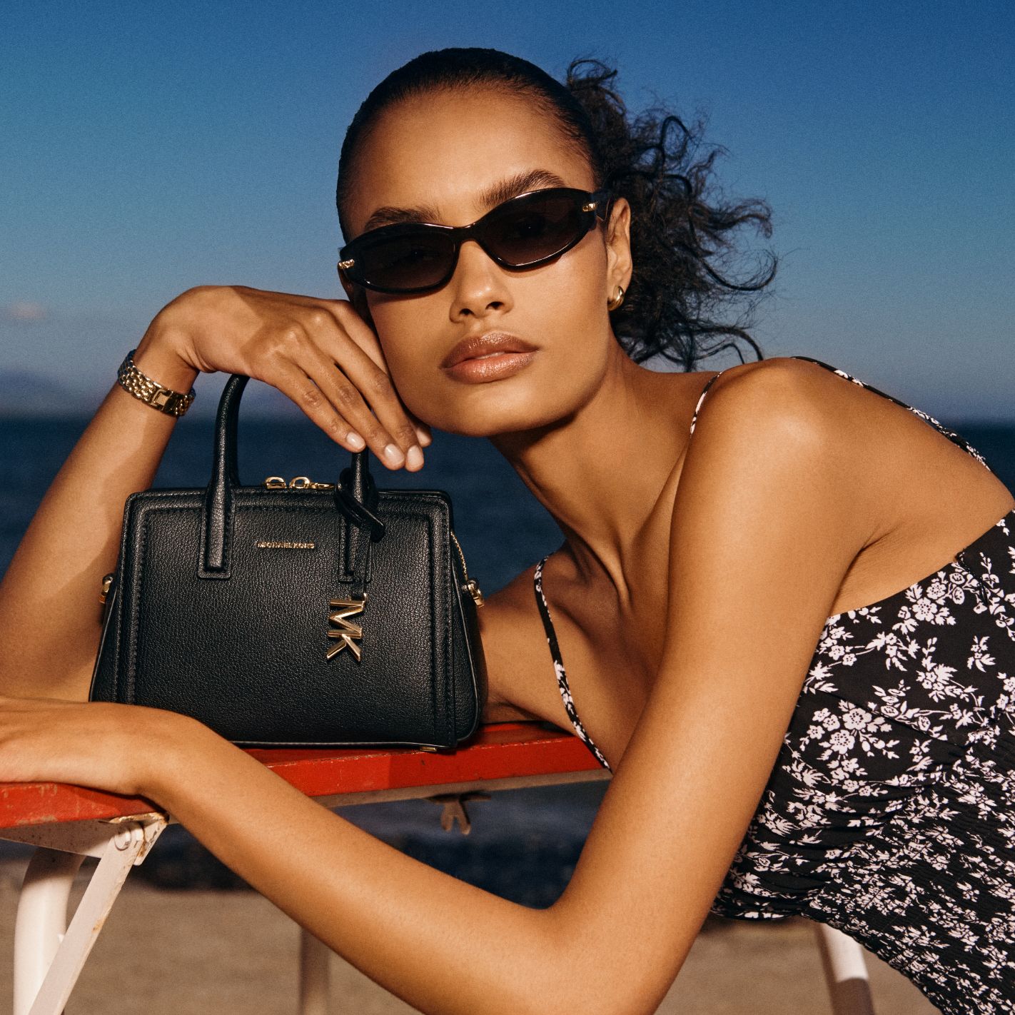 model with mini black laila handbag