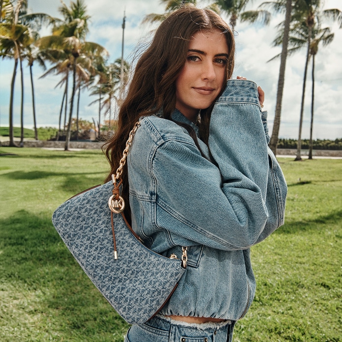 model with denim nolita handbag